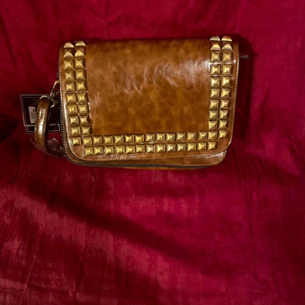 Medium size brown shoulder purse with decorative detail